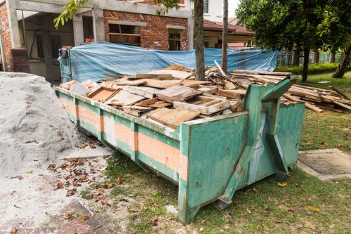 Construction site with organized waste clearance in Peckham